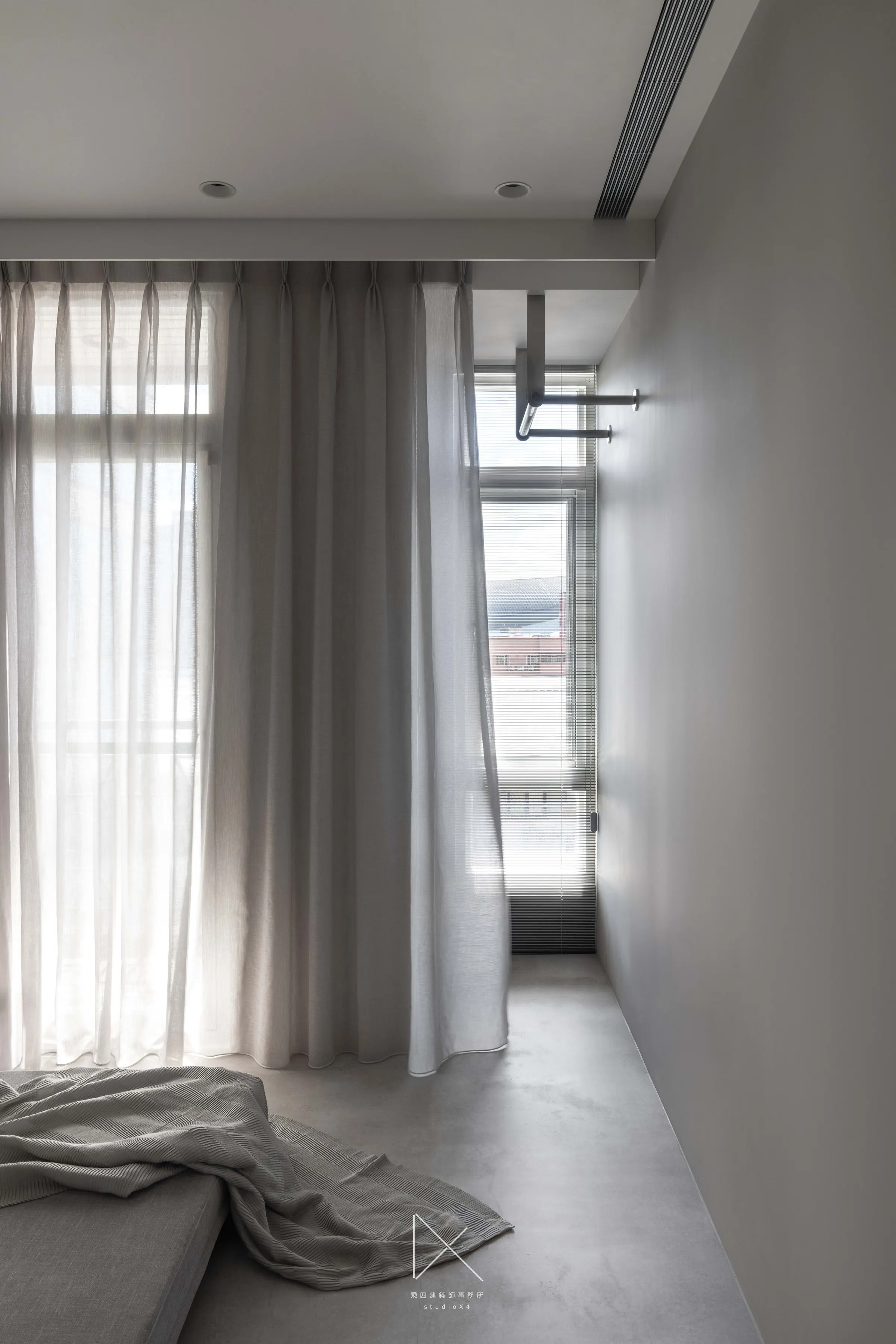 Service balcony light and the multi-function zone's timber grid — both are quiet corners that get used every day.